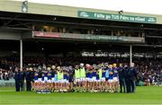 15 June 2024; Tipperary players and management team stand for the playing of the Amhrán na bhFiann before the Electric Ireland GAA Hurling All-Ireland Minor Hurling Championship semi-final match between Tipperary and Galway at TUS Gaelic Grounds in Limerick. Photo by Tom Beary/Sportsfile