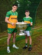 18 June 2024; In attendance at the launch of the GAA Football All-Ireland Senior Championship National 2024 at The Glen Centre in Maghera, Derry, are Caolan McColgan of Donegal and Fintan O'Kane, age 11, from Watty Grahams GAC Glen and the Sam Maguire Cup. Photo by Brendan Moran/Sportsfile
