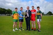 18 June 2024; In attendance at the launch of the GAA Football All-Ireland Senior Championship National 2024 at The Glen Centre in Maghera, Derry, are footballers from left, Caolan McColgan of Donegal, Brian Howard of Dublin, Emmett Bradley of Derry and Ruairi Murphy of Kerry with Uachtarán Chumann Lúthchleas Gael Jarlath Burns and the Sam Maguire Cup. Photo by Brendan Moran/Sportsfile