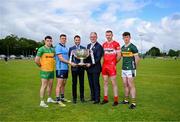 18 June 2024; In attendance at the launch of the GAA Football All-Ireland Senior Championship National 2024 at The Glen Centre in Maghera, Derry, are footballers from left, Caolan McColgan of Donegal, Brian Howard of Dublin, Emmett Bradley of Derry and Ruairi Murphy of Kerry with Uachtarán Chumann Lúthchleas Gael Jarlath Burns, Adam Morgan of AIB and the Sam Maguire Cup. Photo by Brendan Moran/Sportsfile