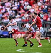 15 June 2024; Ruairí Canavan of Tyrone shoots, next to Darragh Canavan of Tyrone and Daniel O' Mahony of Cork, during the GAA Football All-Ireland Senior Championship Round 3 match between Cork and Tyrone at Glenisk O'Connor Park in Tullamore, Offaly. Photo by Piaras Ó Mídheach/Sportsfile