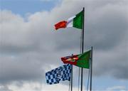 16 June 2024; The Tricolour, Mayo, right, and Dublin, left, flags flutter in the wind during the GAA Football All-Ireland Senior Championship Round 3 match between Dublin and Mayo at Dr Hyde Park in Roscommon. Photo by Ray McManus/Sportsfile