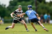 22 June 2024; Braden Dunlea of Midleton, Cork, in action against Jamie Egan of Oranmore Maree, Galway, during the John West Féile na nGael Camogie and Hurling Division One Finals at Hailo Tiles Wexford GAA Centre of Excellence in Ferns, Wexford.  Photo by Harry Murphy/Sportsfile