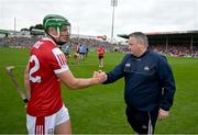 22 June 2024; Robbie O'Flynn of Cork with Cork manager Pat Ryan after the GAA Hurling All-Ireland Senior Championship quarter-final match between Dublin and Cork at FBD Semple Stadium in Thurles, Tipperary. Photo by Ray McManus/Sportsfile