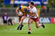 22 June 2024; Eoin McCormack of Roscommon is tackled by Darragh Canavan of Tyrone during the GAA Football All-Ireland Senior Championship preliminary quarter-final match between Tyrone and Roscommon at O'Neill's Healy Park in Omagh, Tyrone. Photo by Ben McShane/Sportsfile