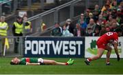 22 June 2024; Jordan Flynn of Mayo, left, after colliding with Conor Doherty of Derry during the GAA Football All-Ireland Senior Championship preliminary quarter-final match between Mayo and Derry at Hastings Insurance MacHale Park in Castlebar, Mayo. Photo by Seb Daly/Sportsfile
