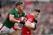 22 June 2024; Gareth McKinless of Derry in action against Jordan Flynn of Mayo during the GAA Football All-Ireland Senior Championship preliminary quarter-final match between Mayo and Derry at Hastings Insurance MacHale Park in Castlebar, Mayo. Photo by Seb Daly/Sportsfile