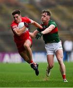 22 June 2024; Conor Doherty of Derry in action against Eoghan McLaughlin of Mayo during the GAA Football All-Ireland Senior Championship preliminary quarter-final match between Mayo and Derry at Hastings Insurance MacHale Park in Castlebar, Mayo. Photo by Seb Daly/Sportsfile