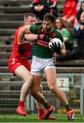 22 June 2024; Aidan O'Shea of Mayo in action against Emmett Bradley of Derry during the GAA Football All-Ireland Senior Championship preliminary quarter-final match between Mayo and Derry at Hastings Insurance MacHale Park in Castlebar, Mayo. Photo by Seb Daly/Sportsfile