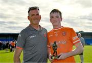23 June 2024; Dáithí O'Callaghan of Armagh pictured with his father Anthony after being awarded Player of the Match in today's Electric Ireland All-Ireland Minor Football semi-final match between Armagh and Mayo at Glennon Brothers Pearse Park in Longford. #ThisIsMajor. Photo by Sam Barnes/Sportsfile