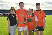 23 June 2024; Dáithí O'Callaghan of Armagh pictured with his family, from left, sister Saorlaith Kerry, mother Roisin O'Callaghan and brother Tadhg O'Callaghan, after being awarded Player of the Match in today's Electric Ireland All-Ireland Minor Football semi-final match between Armagh and Mayo at Glennon Brothers Pearse Park in Longford. #ThisIsMajor. Photo by Sam Barnes/Sportsfile
