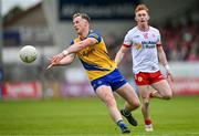 22 June 2024; Eoin McCormack of Roscommon in action against Sean O’Donnell of Tyrone during the GAA Football All-Ireland Senior Championship preliminary quarter-final match between Tyrone and Roscommon at O'Neill's Healy Park in Omagh, Tyrone. Photo by Ben McShane/Sportsfile
