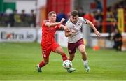 28 June 2024; Edward McCarthy of Galway United in action against Liam Burt of Shelbourne during the SSE Airtricity Men's Premier Division match between Shelbourne and Galway United at Tolka Park in Dublin. Photo by Stephen McCarthy/Sportsfile