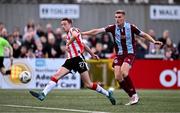 28 June 2024; Daniel Kelly of Derry City scores his side's third goal despite the attention of Jack Keaney of Drogheda United during the SSE Airtricity Men's Premier Division match between Derry City and Drogheda United at The Ryan McBride Brandywell Stadium in Derry. Photo by Ben McShane/Sportsfile