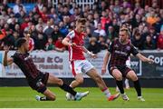 28 June 2024; Mason Melia of St Patrick's Athletic in action against Bohemians players Jake Carroll, left, and Martin Miller during the SSE Airtricity Men's Premier Division match between St Patrick's Athletic and Bohemians at Richmond Park in Dublin. Photo by Seb Daly/Sportsfile