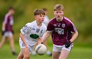 29 June 2024; Sean Og Finn of Clane in action against Ronan McConnell of Bredagh during the John West Féile Peile na nÓg Division One Finals 2024 at the Connacht GAA Centre of Excellence in Bekan, Mayo. Photo by Ben McShane/Sportsfile