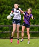 29 June 2024; Grace Gleeson of New York in action against Laura Russell of Kilmacud Crokes during the John West Féile Peile na nÓg Division One Finals 2024 at the Connacht GAA Centre of Excellence in Bekan, Mayo. Photo by Ben McShane/Sportsfile