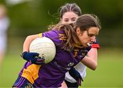 29 June 2024; Aoife Donovan of Kilmacud Crokes in action against Hazel McGourty of New York during the John West Féile Peile na nÓg Division One Finals 2024 at the Connacht GAA Centre of Excellence in Bekan, Mayo. Photo by Ben McShane/Sportsfile