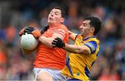 29 June 2024; Paddy Burns of Armagh is tackled by Ciaran Lennon of Roscommon during the GAA Football All-Ireland Senior Championship quarter-final match between Armagh and Roscommon at Croke Park in Dublin. Photo by Stephen McCarthy/Sportsfile