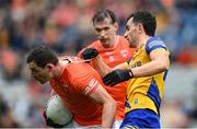 29 June 2024; Paddy Burns of Armagh is tackled by Ciaran Lennon of Roscommon during the GAA Football All-Ireland Senior Championship quarter-final match between Armagh and Roscommon at Croke Park in Dublin. Photo by Stephen McCarthy/Sportsfile