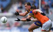 29 June 2024; Enda Smith of Roscommon makes a pass despite the attention of Andrew Murnin of Armagh during the GAA Football All-Ireland Senior Championship quarter-final match between Armagh and Roscommon at Croke Park in Dublin. Photo by Shauna Clinton/Sportsfile
