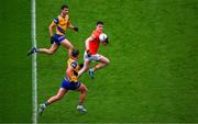 29 June 2024; Ben Crealey of Armagh races clear of Ciaran Lennon, left, and Enda Smith of Roscommon during the GAA Football All-Ireland Senior Championship quarter-final match between Armagh and Roscommon at Croke Park in Dublin. Photo by Ray McManus/Sportsfile
