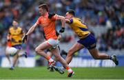 29 June 2024; Ross McQuillan of Armagh is tackled by Enda Smith of Roscommon during the GAA Football All-Ireland Senior Championship quarter-final match between Armagh and Roscommon at Croke Park in Dublin. Photo by Shauna Clinton/Sportsfile