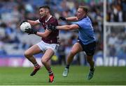 29 June 2024; Séan Mulkerrin of Galway is tackled by Ciaran Kilkenny of Dublin during the GAA Football All-Ireland Senior Championship quarter-final match between Dublin and Galway at Croke Park in Dublin. Photo by Shauna Clinton/Sportsfile