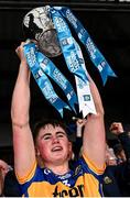 29 June 2024; Tipperary captain Cathal O'Reilly lifts the Irish Press Cup after his side's victory in the Electric Ireland GAA Hurling All-Ireland Minor Championship final match between Kilkenny and Tipperary at UPMC Nowlan Park in Kilkenny. Photo by Seb Daly/Sportsfile