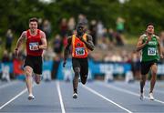 30 June 2024; Israel Olatunde of Tallaght AC, centre, on his way winning the men's 100m during day two of the 123.ie National Outdoor Senior Championships at Morton Stadium in Santry, Dublin. Photo by Sam Barnes/Sportsfile