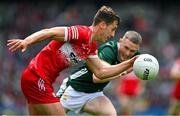 30 June 2024; Shane McGuigan of Derry in action against Jason Foley of Kerry during the GAA Football All-Ireland Senior Championship quarter-final match between Kerry and Derry at Croke Park in Dublin. Photo by Brendan Moran/Sportsfile