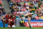30 June 2024; Gavin White of Kerry has his shot blocked by Shane McGuigan of Derry during the GAA Football All-Ireland Senior Championship quarter-final match between Kerry and Derry at Croke Park in Dublin. Photo by John Sheridan/Sportsfile