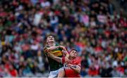 30 June 2024; Sean O'Shea of Kerry and Eunan Mulholland of Derry look above at a high ball during the GAA Football All-Ireland Senior Championship quarter-final match between Kerry and Derry at Croke Park in Dublin. Photo by Shauna Clinton/Sportsfile