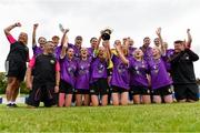 30 June 2024; Wexford players and management team celebrate with the cup after the FAI Women's Under 19 Inter-League Cup final match between Wexford Women’s Schoolgirls Soccer League and Galway District League at Jackman Park in Limerick. Photo by Tom Beary/Sportsfile