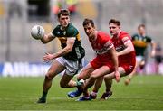 30 June 2024; Gavin White of Kerry in action against Shane McGuigan, centre, and Ethan Doherty of Derry during the GAA Football All-Ireland Senior Championship quarter-final match between Kerry and Derry at Croke Park in Dublin. Photo by Ben McShane/Sportsfile