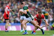 30 June 2024; Diarmuid O'Connor of Kerry is tackled by Shane McGuigan of Derry during the GAA Football All-Ireland Senior Championship quarter-final match between Kerry and Derry at Croke Park in Dublin. Photo by Shauna Clinton/Sportsfile