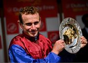 30 June 2024; Jockey Ryan Moore with the plate after winning the Dubai Duty Free Irish Derby Group 1 on day three of the Dubai Duty Free Irish Derby Festival at The Curragh Racecourse in Kildare. Photo by David Fitzgerald/Sportsfile