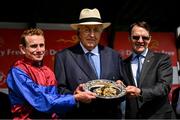 30 June 2024; From left, jockey Ryan Moore, owner John Magnier and trainer Aidan O'Brien after winning the Dubai Duty Free Irish Derby Group 1 on day three of the Dubai Duty Free Irish Derby Festival at The Curragh Racecourse in Kildare. Photo by David Fitzgerald/Sportsfile