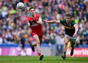 30 June 2024; Eoin McEvoy of Derry in action against Gavin White of Kerry during the GAA Football All-Ireland Senior Championship quarter-final match between Kerry and Derry at Croke Park in Dublin. Photo by Ben McShane/Sportsfile