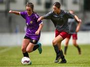 30 June 2024; Hannah Kehoe of Wexford and District is tackled by Anna Daly of Galway during the FAI Women's Under 19 Inter-League Cup final match between Wexford Women’s Schoolgirls Soccer League and Galway District League at Jackman Park in Limerick. Photo by Tom Beary/Sportsfile