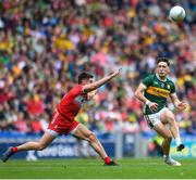 30 June 2024; Paudie Clifford of Kerry in action against Conor Doherty of Derry during the GAA Football All-Ireland Senior Championship quarter-final match between Kerry and Derry at Croke Park in Dublin. Photo by John Sheridan/Sportsfile
