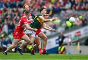 30 June 2024; Paudie Clifford of Kerry in action against Derry players, from left, Niall Toner, Conor Glass and Conor Doherty during the GAA Football All-Ireland Senior Championship quarter-final match between Kerry and Derry at Croke Park in Dublin. Photo by Brendan Moran/Sportsfile