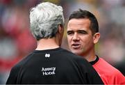 30 June 2024; Louth manager Ger Brennan, right, and Donegal manager Jim McGuinness after the GAA Football All-Ireland Senior Championship quarter-final match between Donegal and Louth at Croke Park in Dublin. Photo by Brendan Moran/Sportsfile