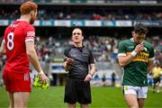 30 June 2024; Referee David Coldrick performs the coin toss in the company of team captains Conor Glass of Derry, left, and Paudie Clifford of Kerry before the GAA Football All-Ireland Senior Championship quarter-final match between Kerry and Derry at Croke Park in Dublin. Photo by Brendan Moran/Sportsfile