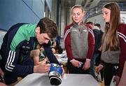 2 July 2024; Boxer Aidan Walsh signs autographs for attendees during the Team Ireland Open Training Day ahead of the Paris 2024 Olympic Games at the National Indoor Arena on the Sport Ireland Campus in Dublin. Photo by Sam Barnes/Sportsfile