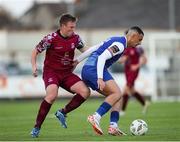 4 July 2024; Yoyo Mahdy of Treaty United in action against Jason Abbott of Cobh Ramblers during the SSE Airtricity Men's First Division match between Treaty United and Cobh Ramblers at Markets Field in Limerick. Photo by Michael P Ryan/Sportsfile