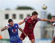 4 July 2024; Dean Larkin of Cobh Ramblers in action against Enda Curran of Treaty United  during the SSE Airtricity Men's First Division match between Treaty United and Cobh Ramblers at Markets Field in Limerick. Photo by Michael P Ryan/Sportsfile