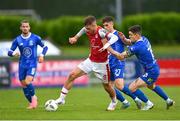 4 July 2024; Mason Melia of St Patrick's Athletic in action against Darragh Leahy, right, and Dean McMenany of Waterford during the SSE Airtricity Men's Premier Division match between Waterford and St Patrick's Athletic at the Regional Sports Centre in Waterford. Photo by Tyler Miller/Sportsfile