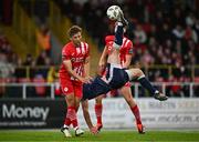 4 July 2024; Patrick Hoban of Derry City attempts an overhead kick despite the attention of John Ross Wilson of Sligo Rovers during the SSE Airtricity Men's Premier Division match between Sligo Rovers and Derry City at The Showgrounds in Sligo. Photo by Harry Murphy/Sportsfile