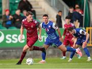 4 July 2024; Dean Larkin of Cobh Ramblers in action against Enda Curran of Treaty United  during the SSE Airtricity Men's First Division match between Treaty United and Cobh Ramblers at Markets Field in Limerick. Photo by Michael P Ryan/Sportsfile